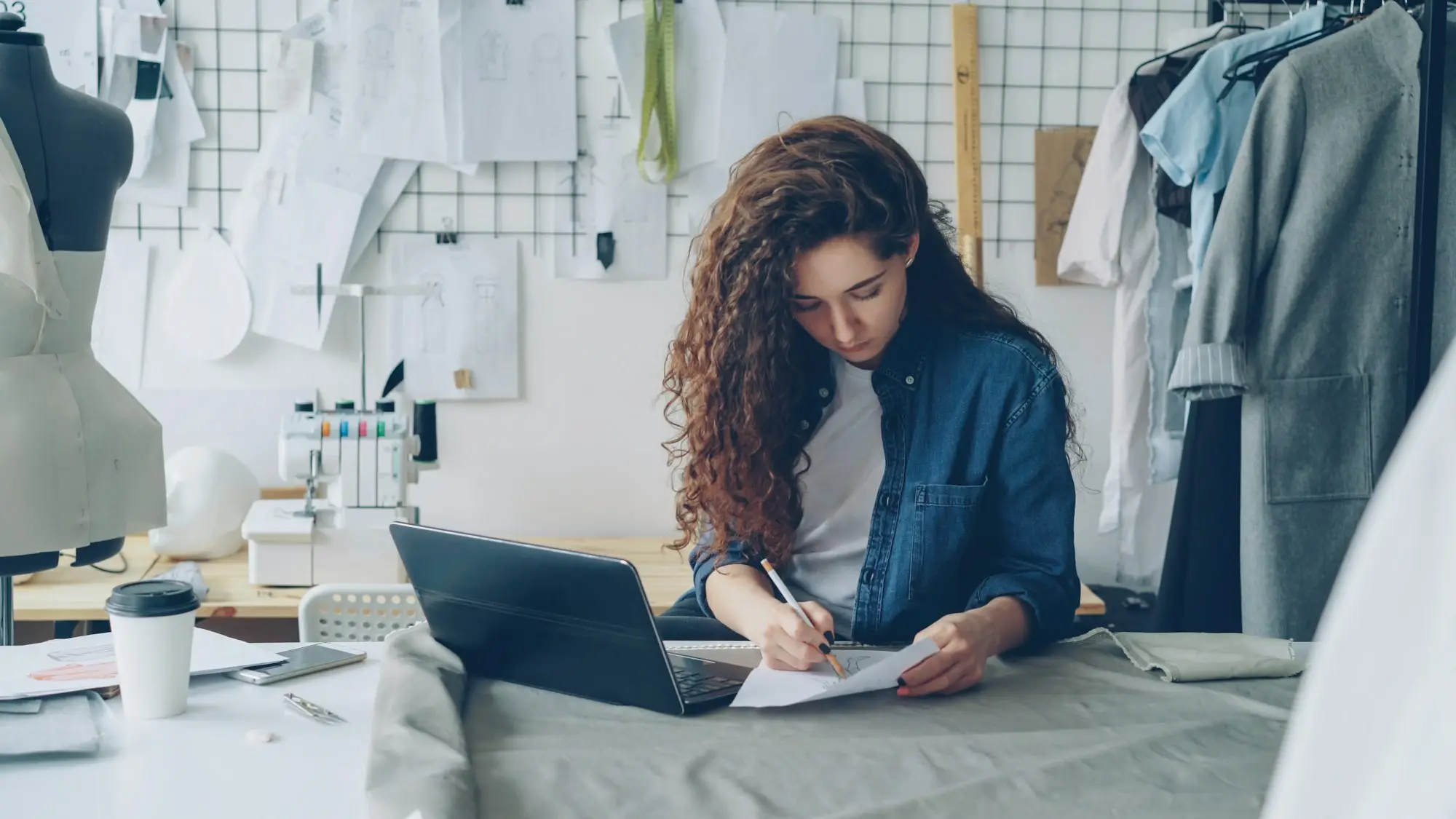 Business owner filling in an application form on her laptop