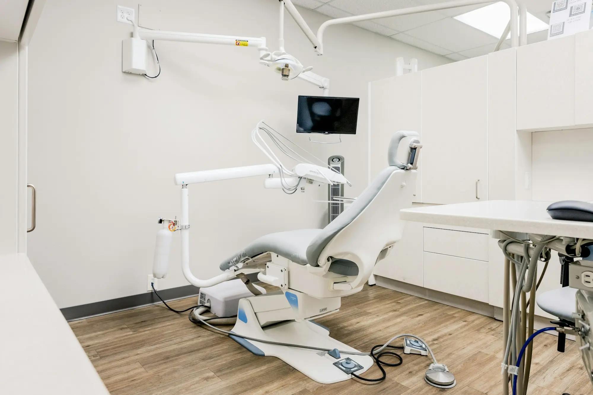 Modern dental surgery with a dental chair and equipment